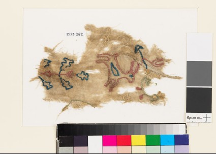 Textile fragment from a garment with deer, plant, flower-heads, and birdfront