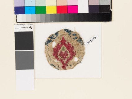 Roundel textile fragment with stylized leaffront