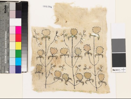 Textile fragment with stylized flowers and leavesfront