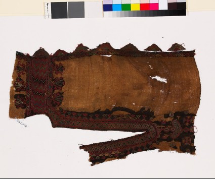 Textile fragment from the neck of a dress with stylized floral shapesfront