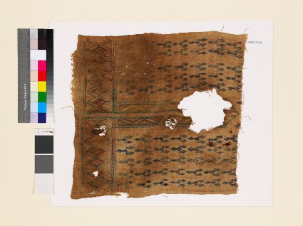 Textile fragment with linked diamond-shapes, possibly from the front of a garmentfront