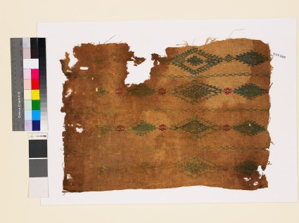 Textile fragment with linked diamond-shaped medallions and latticefront