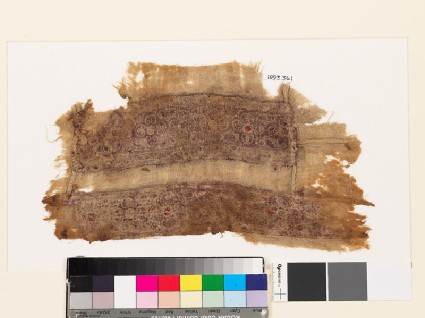 Textile fragment from a garment with bands of stylized floral shapes, quatrefoils, and rosettesfront