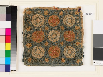 Textile fragment with circles, stars, and interlace, possibly a pot holderfront