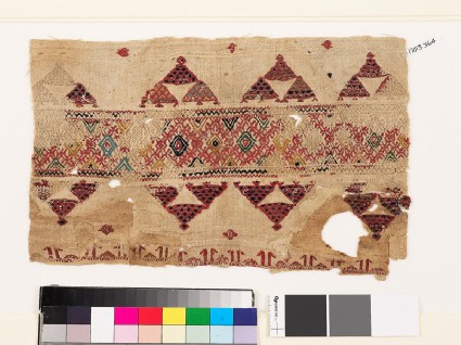 Textile fragment with band of diamond-shapes, triangles, and pseudo-kufic inscriptionfront