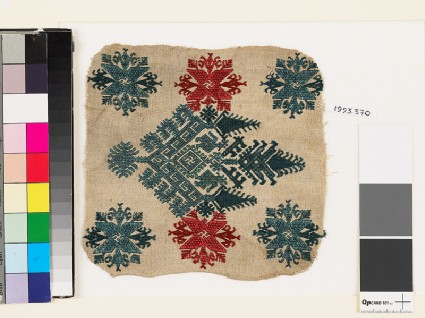 Textile fragment with an elaborate medallion, trees, birds, and flowersfront