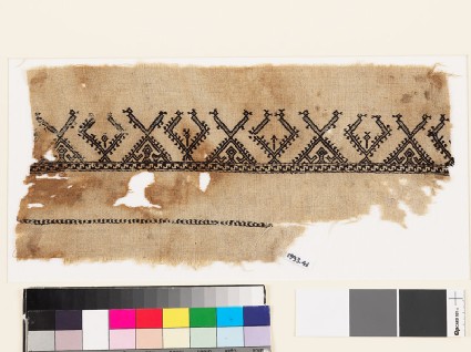 Textile fragment with stylized birds and treesfront