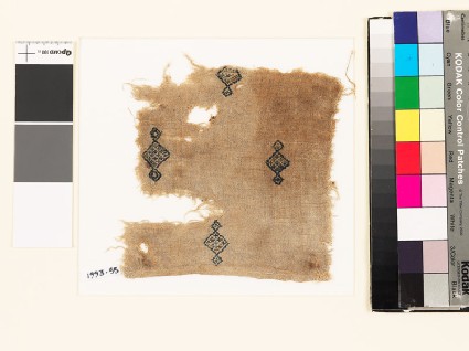 Textile fragment with diamond-shaped medallions and crossesfront