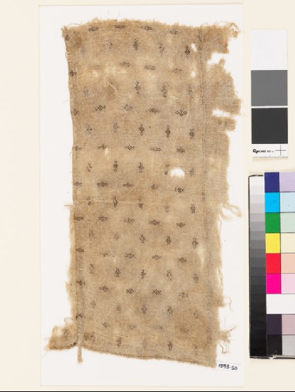 Textile fragment with diamond-shaped medallionsfront