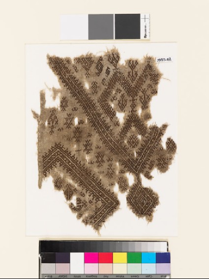 Textile fragment from the neck of a garment with geometric shapesfront