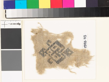 Textile fragment with geometric heart-shaped medallionfront