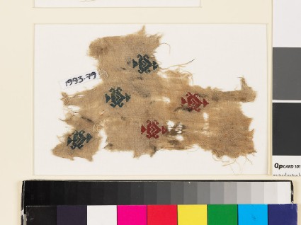 Textile fragment with heart-shaped medallions, triangles, and hooksfront