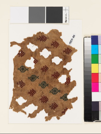 Textile fragment with fish and hexagonal medallionsfront