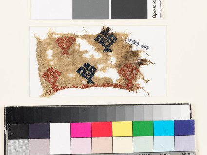 Textile fragment with floral shapes and possibly fishfront