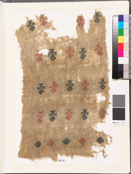 Textile fragment with stylized floral shapes and diamond-shapesfront