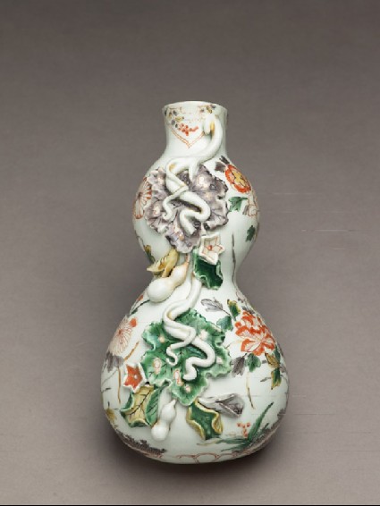 Wall vase with flowers and tendrils in high relieffront