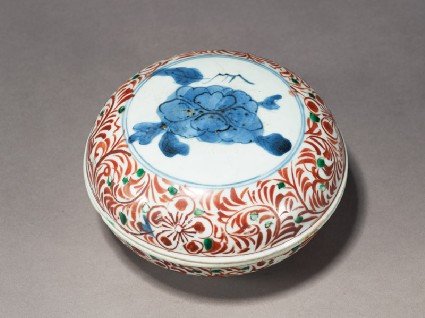 Box with peony enclosed by a floral scroll borderoblique