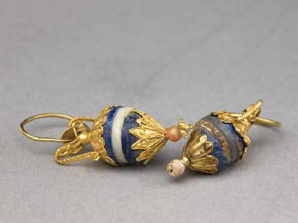 Gold earrings with lapis lazuli, ivory, and quartz pendantsoblique