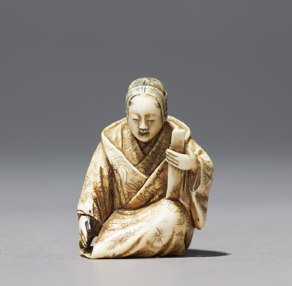 Netsuke in the form of a Nō actor wearing a maskfront