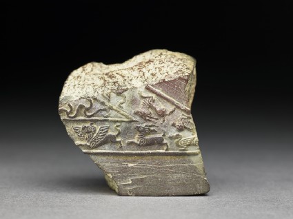 Fragment of a jeweller's mould with animals and birds in relieffront