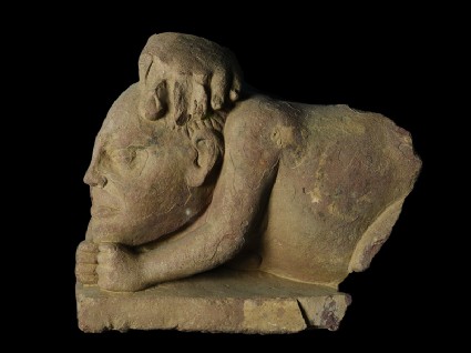 Fragmentary figure of a crouching yaksha, or nature spiritfront