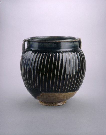 Black ware jar with white stripesside