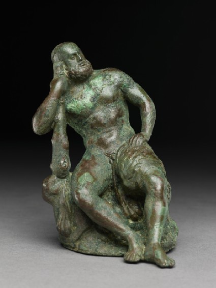 Figure of the hero god Heracles with his club seated on a lionfront