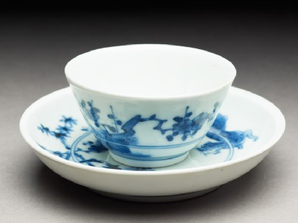 Cup and saucer with leaping tigersoblique