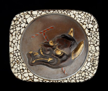 Hako netsuke depicting the Hannya mask from the Nō play 'Dōjōji'front