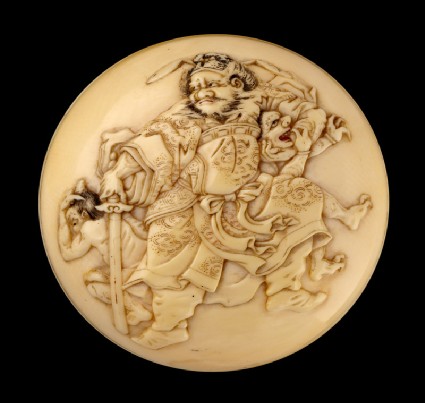 Manjū netsuke depicting Shōki the Demon Queller with two demonsfront