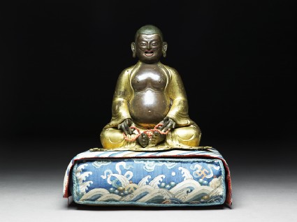 Figure of Hvashang seated on a cushionfront