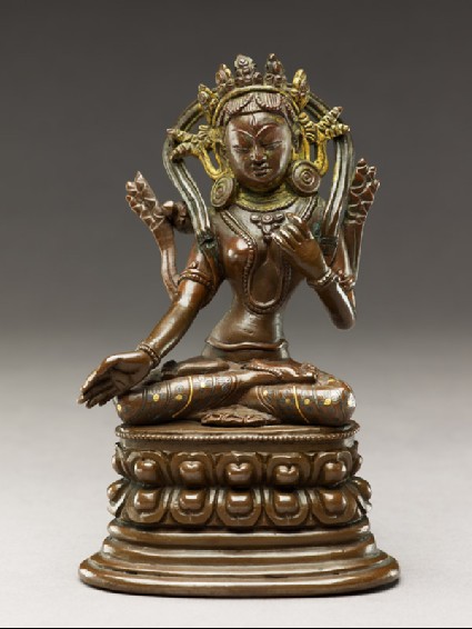 Seated figure of a female deityfront