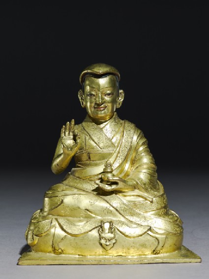 Seated figure of Tashi Lamafront