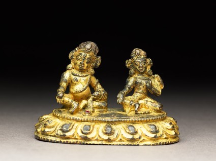 Figure of a male deity and his consort on a lotus-petalled throneside