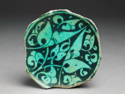 Base fragment of a bowl with floral decorationtop