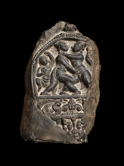 Pillar fragment with two wrestlersfront