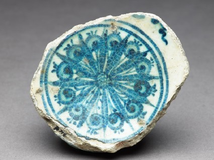 Base fragment of a bowl with radial decorationfront