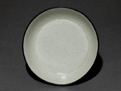 White ware bowl with dragons, flowers, and cloudstop