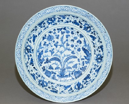 Blue-and-white dish with plantstop