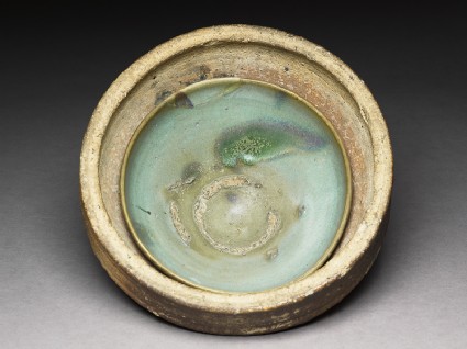 Bowl stuck in its firing saggaroblique