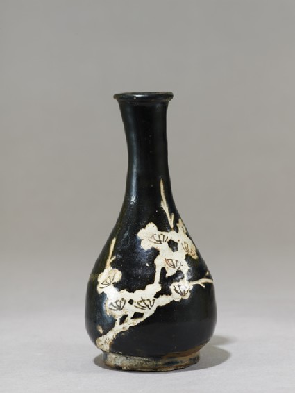 Black ware vase with prunus sprayside