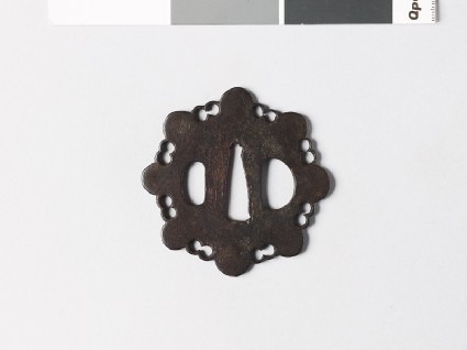 Tsuba in the form of a stylized flowerfront