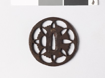 Tsuba with floral device of overlapping petalsfront