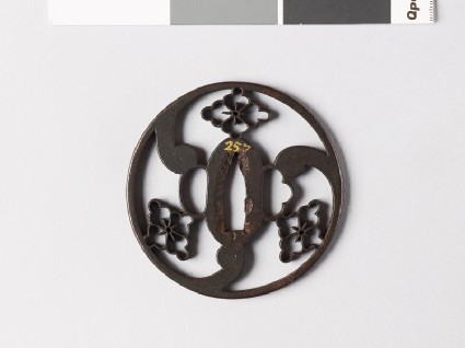 Round tsuba with karahana, or Chinese flowersfront