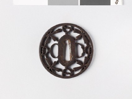 Round tsuba with flowers and yin-yang symbolsfront