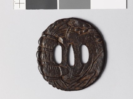 Tsuba with plants and a Buddhist invocationfront