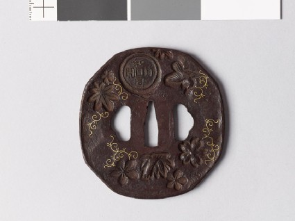 Octagonal tsuba with nine different stampsfront