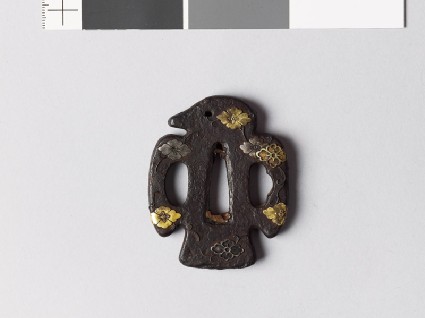 Tsuba in the shape of a bird and with karahana, or Chinese flowersfront