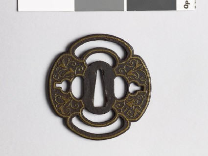 Mokkō-shaped tsuba with karakusa, or scrolling plant patternfront