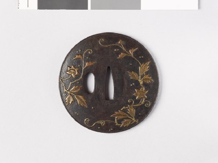 Lenticular tsuba with flowers and dewdropsfront